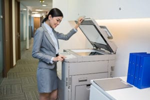 Color copiers are essential to organizations of all shapes and sizes. Whether you're running a small or enterprise-level business, you need a copier machine that's quick, reliable, and supports the office workflow. Of course, there's a lot to consider before making a purchase. After all, these machines don't come cheap. Plus, the last thing you want is to get stuck with an expensive office copy machine that can't keep up and is costly to maintain. To narrow down your search, we've compiled a list of the best commercial color copiers on the market today. So, read on to find your perfect machine. What to Look For in Color Copying Machine Not all color copiers are created equally. Before purchasing a new copying machine for your business, you have a few things you'll want to consider. Here's your office copier checklist: Print speed Paper capacity Scanning abilities Wireless connectivity Memory The above listed are the essential components of your business's copying and printing needs. The print speed you require will depend entirely on your copying and printing volume. The higher the volume, the higher the speed—pages per minute (PPM)—you'll want. When we talk about paper capacity, we're referring the the "tray capacity." Once again, this is directly related to your copying and printing volume. Your tray capacity will also depend on the size of the paper you choose to use. As for the scanning, wireless connectivity, and memory—all of these things typically come standard with a multi-function copier/printer. The most important factors to look at here are volume and speed. A good machine will have an automatic document feeder or duplexer for high-volume scanning. Additionally, the higher the memory capacity, the quicker the machine will be able to process jobs. Having wireless connectivity also ensures that your employees can print, scan, and copy from any device, contributing to their overall productivity rate. The Best Color Copiers On the Market Here's our round-up of the best color copiers on the market today. We based our decision on which machines had the most features, the best reputation, and the best office accessibility. Toshiba e-STUDIO 8515A Price: $46,880 Features and specs: Printing speed between 55 ppm-86 ppm speed, 4 GB memory, 320 GB hard drive, 1.33 GHz processor, 10.1" Elevate interface, e-BRIDGE NEXT controller, ethernet and wi-fi connectivity The Toshiba e-STUDIO 8515A color copier is the latest in the Toshiba e-STUDIO lineup. This color copier replaced the e-STUDIO 8508A Series and with comes a whole new set of features. It's also wireless, B&W copy capable, and comes with an inner stapler. One of its most notable features includes Elevate, which is a brand new touch-screen interface that works like a tablet. It has an embedded browser and customizable icons for improved workflows. The icons provide a one-touch button for functions such as single copy, copy, and staple, and emailing PDFs, to name a few. The e-STUDIO 8515A has a quick warm-up time of 20 seconds and a copy time that ranges from 4.1 seconds to 5.2 seconds. Roughly, this copier can produce 85 pages per minute. Moreover, it offers a heavy-duty cycle of 720,000 pages per month—without breaking down. The copier is also capable of sending faxes to over 2,000 destinations, printing, and scanning documents. It's equipped with two paper trays to support a capacity of 3,520 sheets, and it boasts a large-capacity tandem tray feeder and a 120-sheet bypass. Pros: It's one of the fastest copiers on the market Has an intelligent and customizable interface It's a multi-function machine Cons: High purchase costs High maintenance costs Not suitable for smaller businesses Overall, this is the perfect color copier for enterprise-level organizations that handle a large volume of paperwork. Of course, due to the price, you would likely have to lease the machine. Sharp MX-5070N A3 Tabloid-size Copier Price: $5,399 Features and specs: Printing speeds up to 50 ppm, 1.9 GHz multi-processor, 5 GB memory, 500 GB hard drive, 1200-3600 sheet capacity, laser technology, walk-up motion sensor, ethernet and wi-fi connectivity The MX-5070N A3 is part of Sharp's Color Advanced series. This machine is a multi-function machine packed with features, and it sports a two-headed document feeder that can scan up to 200 images per minute. The walk-up motion sensor can sense you from just a few feet away, and it has a 10.1" customizable LCD screen. The LCD allows you to 'tap," "flick," and "slide," much like you would on your smartphone. Sharp also includes a retractable keyboard for entering email addresses, and other information as the multi-functionality of this machine allows you to not only copy but send an email, faxes, print, and scan. Warm-time takes up to 15 seconds and first copy time—in color—takes roughly 8.1 seconds. Automatic duplexing comes standard with this machine, and while the paper inputs start with 550 sheets, there are options to upgrade to achieve the maximum capacity of 6,300 sheets. These options will range from $855 to $2,000 in price. There's also a standard single-duplexing document feeder with a 150 sheet capacity and a 250 sheet exit tray. Aside from the standard trays, the color copier also offers finishing accessories such as an inner 50-sheet stapling finisher. Accessories also range in price. Pros: Has an automatic document feeder Fast copying and printing times It's feature-rich and can accommodate all workflows Cons: Standard paper capacity is a bit low Accessories are more like costly upgrades It's one of the more expensive models Overall this multi-functional and feature-rich copier is perfect for small to mid-level organizations. There's even a leasing option, and it's a mobile-friendly machine. HP Enterprise Flow M880z MFP A2W75A With Finisher Price: $8,999 Features: Printing speeds up to 45 ppm, HP ImageREt 4800 resolution technology, automatic paper sensor, 2.5 GB memory, 500 GB hard drive, 4x500 sheet input tray, two-sided single-pass scanning, ethernet and wi-fi connectivity The HP Enterprise Flow M880z is a top of the line, enterprise color copier machine with printing and scanning functions. One of the features we like most on this color copier is the HP EveryPage, which detects potential errors and missed pages before your copies come out. At 45 ppm, it's also an incredibly fast machine. The machine is equipped with an intuitive LCD touch screen and a large pull-out keyboard to allow you to swipe, tap, and type with ease. This color copier also offers double-sided single-pass scanning for speed, and it's mobile-friendly, so your employees can print with ease right from their mobile device. Moreover, you can manage content and workflow with HP's FLow CRM, which gives you options such as file sharing. It's equipped with an automatic document feeder, and several finishing accessories come with this machine, including stapling and stitching. Pros: Has an automatic document feeder Offers two-sided single-pass scanning It's CRM accommodate all kinds of workflows Cons: It's one of the pricier models, so you'll likely need to lease Its standard paper capacity is lower than we'd like Overall, the HP Enterprise Flow M880z offers excellent value for its price. However, we'd like to see a higher standard paper capacity on HP's upcoming models. Canon ImageRunner Advance C5560i III Copier Price: $7,990 Features: Printing speeds up to 60 ppm, 4 GB memory, 250 GB hard drive, Canon Dual Custom Processor, My ADVANCE security features, automatic document feature, ethernet, and wireless connectivity Canon has updated its third generation ImageRunner Advance series, and the C5560i color copier is packed with features. For starters, it has upgraded security features such as Security Information Event Management (SEIM), which integrates customers' information automatically. This allows your IT team to detect any potential threats across the globe. This model, in particular, has quick page speeds at 60 ppm and produces the first-page copy within 4.5 seconds. That makes this copier one of the most efficient on our list. The copy machine's memory and RAM can also be upgraded from 4 GB of memory and 250 GB of hard drive to 1 TB. There's also a 10.1" flat screen control panel that operates with the ease of a smartphone. The flat-screen control panel has a feature called My ADVANCE that allows users to customize certain features, including their personal address book, to streamline their workflow. This machine also supports mobile printing and scanning in addition to producing color copies. Like all of Canon's machines, the C5560i comes with a standard dual 550-paper tray and a 100-sheet bypass. Its standard output is 250 sheets. Automatic duplexing is supported, and larger paper trays are offered for an additional price. There are also several finishing options, including stapling and hole punching. Pros: High paper output speed Advanced security features Automatic duplexing Cons: Not suitable for smaller businesses Overall this is one of our favorite color copiers on the list. The only thing we don't like is that this model, in particular, is aimed at small businesses; however, it's more of a mid-level to enterprise machine. Xerox AltaLink C8070/HXF2 Color Copier Price: $31,000 Features: Print speeds up to 70 ppm, monthly duty cycle of 300,000 pages, 1.91 GHz processor, 8 GB memory, 250 GB hard drive, ethernet, and wi-fi direct connectivity, color touch screen The Xerox AltaLink 8000 color copier series is meant for high-volume workflows. The C870 offers the standard paper handling of two trays of 520 sheets each, as well as a 100-sheet bypass. This machine also boasts a high-capacity tandem module tray that totals up to 2,000 sheets and a single-pass duplexing document feeder with a 130-sheet capacity. If you need to operate at a higher volume, you can opt for a 2,000-sheet capacity feeder and a 60-sheet envelope tray. The maximum paper capacity for this option is 5,140 sheets. In addition to copying, this machine is capable of printing, scanning, and faxing in both color and black and white. It has a 10.1" touch screen and hosts a variety of apps, including AppleAir print, Google Cloud Print, and Mopria, just to name a few. Users will be able to print and scan documents from Microsoft 365, OneDrive, DocuShare, Google Drive, and DropBox, as well as their mobile devices. Lastly, Xerox includes a multitude of security features in all its machines as the company is partners with McAfee. Those features include user authentication, secure print, network authentication, hard drive overwrite, IP address filtering, access controls, and many more. Pros: It has an automatic document feeder It's incredibly fast It's feature-rich with maximum security Cons: Not intended for smaller businesses There are no finishing accessories for the C8070 Overall the Xerox AltaLink C8070 is a high-speed and high-capacity color copier. Unfortunately, it's only intended for high-volume businesses. Xerox VersaLink C7030/TXFM2 Color Multifunction Copier Price: $15,193 Features: Print speed up to 30 ppm, automatic duplexing, 12-second warm-up time, 4 GB memory, 320 GB hard drive, 7" color touch screen display, ethernet and wi-fi connectivity, 1.05 GHz dual-core processor, finishing accessories The Xerox VeraLink C7030 is another enterprise-level color copying machine that boasts a first-page print time of 7 seconds or less. It has a maximum monthly duty cycle of 129,000 pages and only takes up to 12 seconds to completely warm-up. With high-speed ethernet and wi-fi connectivity options, this machine can handle all your copying, printing, scanning, and faxing tasks with ease. It's equipped with a 7" color touch-screen display, and it's compatible with a range of operating systems including Linux, MS Window Server 2003, MS Windows 7, MS Windows 2000 Server, MS Windows 2008 Server, HP-UX 11i v3, Apple Mac OS X 10.10, and many more. This machine has a document feeder capacity of 150 sheets as well as a bypass feeder capacity of 100 sheets. It also comes standard with a stapler finishing accessory and a 520-sheet capacity tray. Pros: Has automatic duplexing Works with virtually all operating systems Comes with a stapler finisher High-volume copying and printing capacity Cons: Not as fast as other copying machines in its price range Not suitable for smaller businesses Only comes standard with one finishing accessories Overall the Xerox VersaLink C7030 is a heavy-duty copier matching that gets the job done for mid-level to enterprise-level businesses. However, we feel it could be much faster if Xerox had upgraded their processor for this series. That's not to say that a 7-second page isn't fast, but compared to the speeds of the other copiers on this list, it falls short. Finding the Right Copier Matters The right color copier will make all the difference in your office space. It should also last a long time and need minimal maintenance because, in today's fast-paced world, you can't afford to put your business on hold. If you're looking for a commercial copier, we can help. Let us know what you need, and we'll provide you with competitive quotes on a selection of high-quality color copiers. We'll also throw in a free buyer's guide.